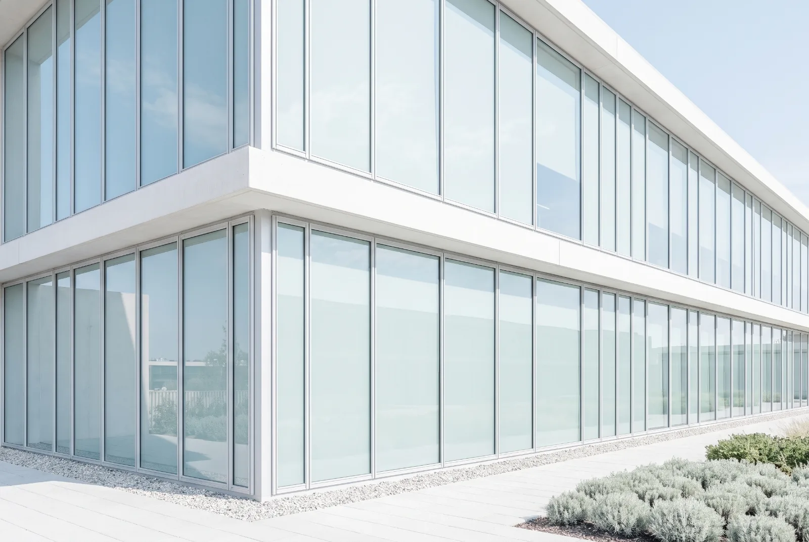 Glazed facade of a quiet operating building in clear daylight