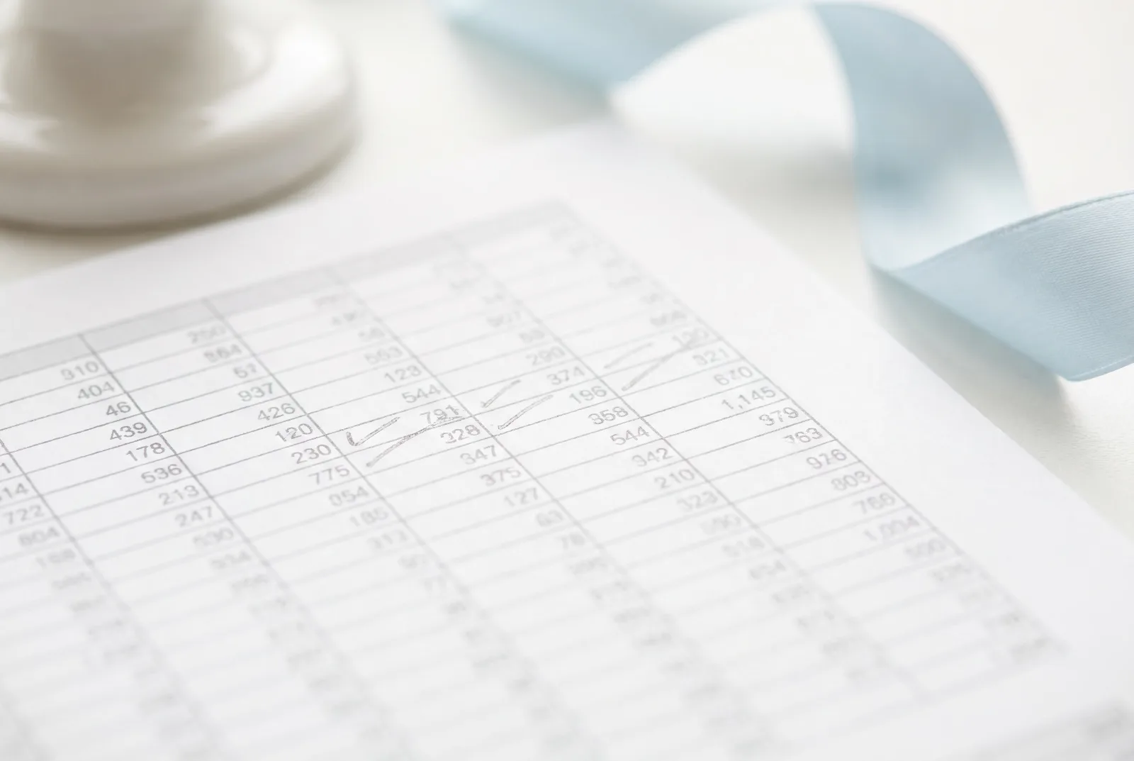 Macro detail of a ruled financial table on matte paper